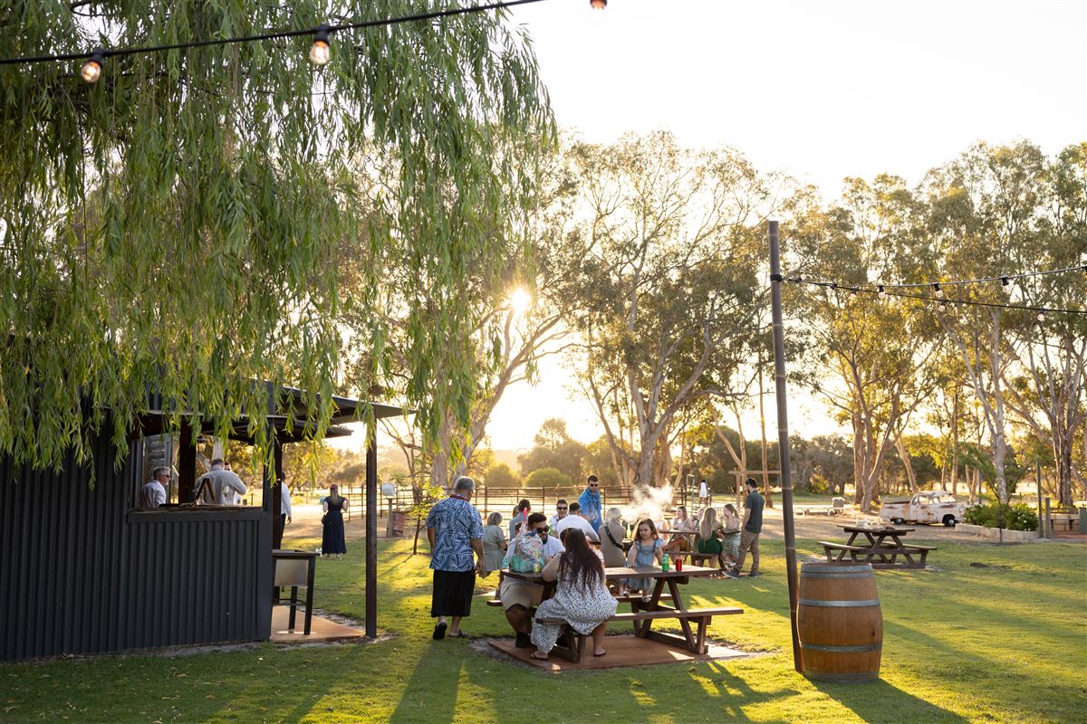 The outside bar hatch and picnic tables on a sunny afternoon