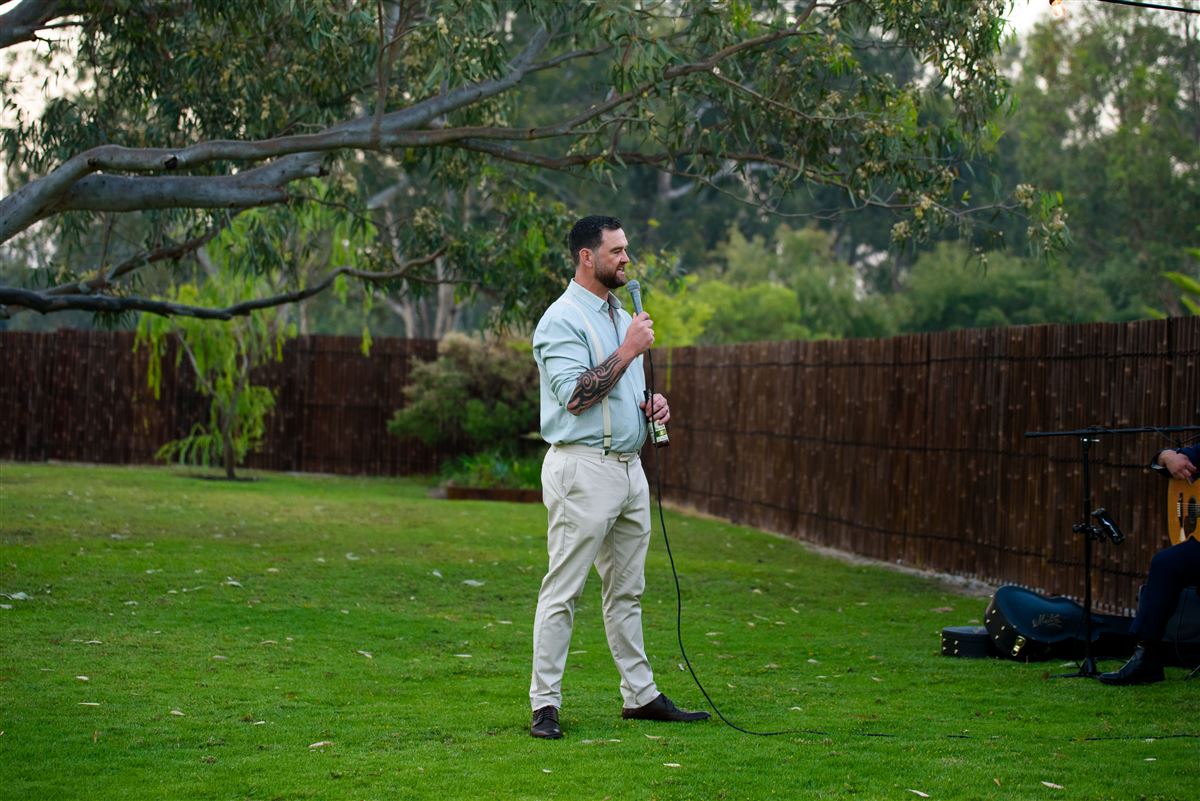 Speeches on the lawn at sunset